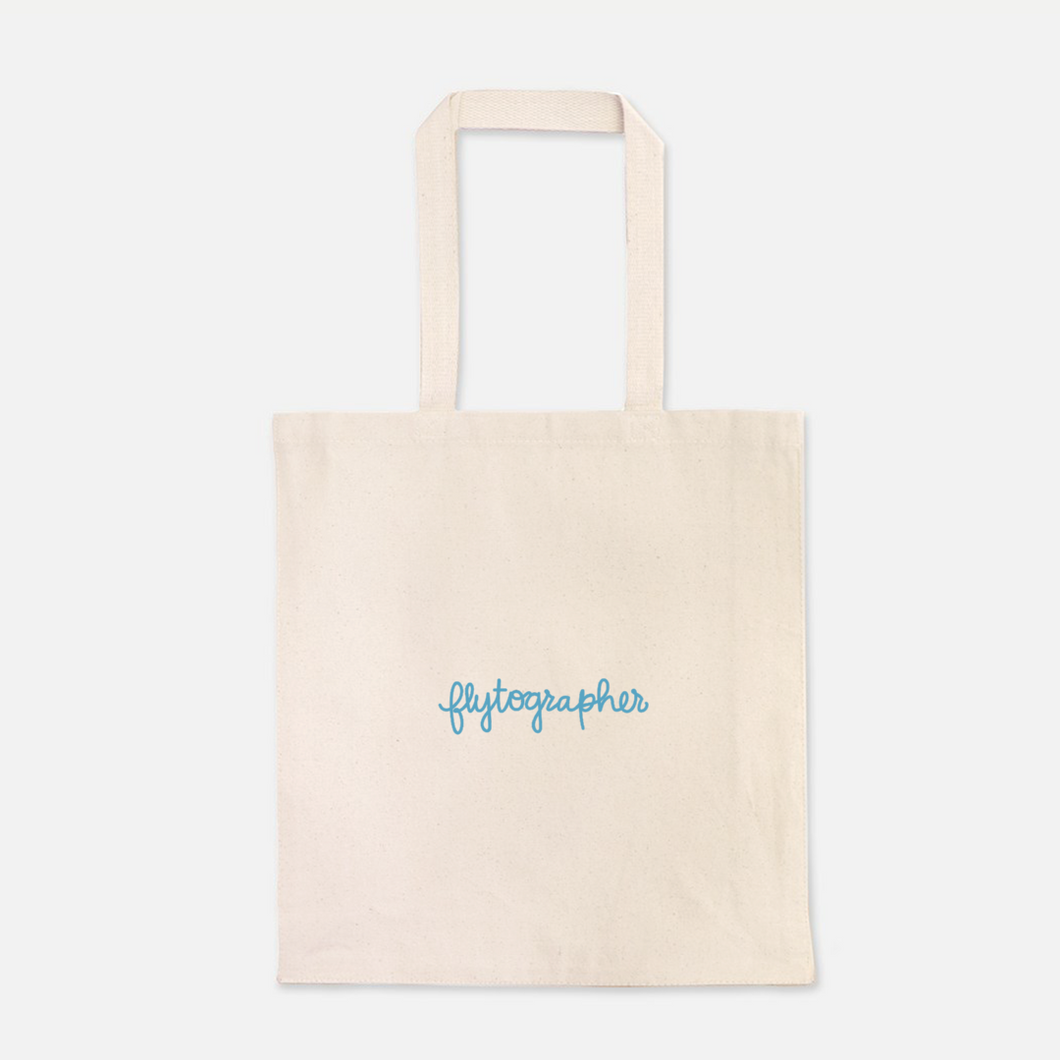 natural colour 100% Cotton Canvas bag with the word with Flytographer logo on the front