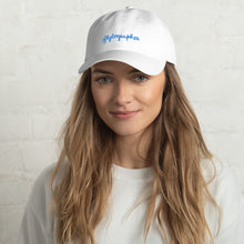Load image into Gallery viewer, woman is wearing 100% Chino cotton twill baseball cap that hat has a low profile with an adjustable strap and curved visor.
