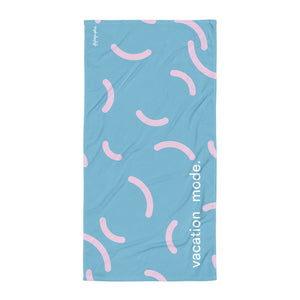 Blue and pink patterned towel with the words "vacation mode" written on it